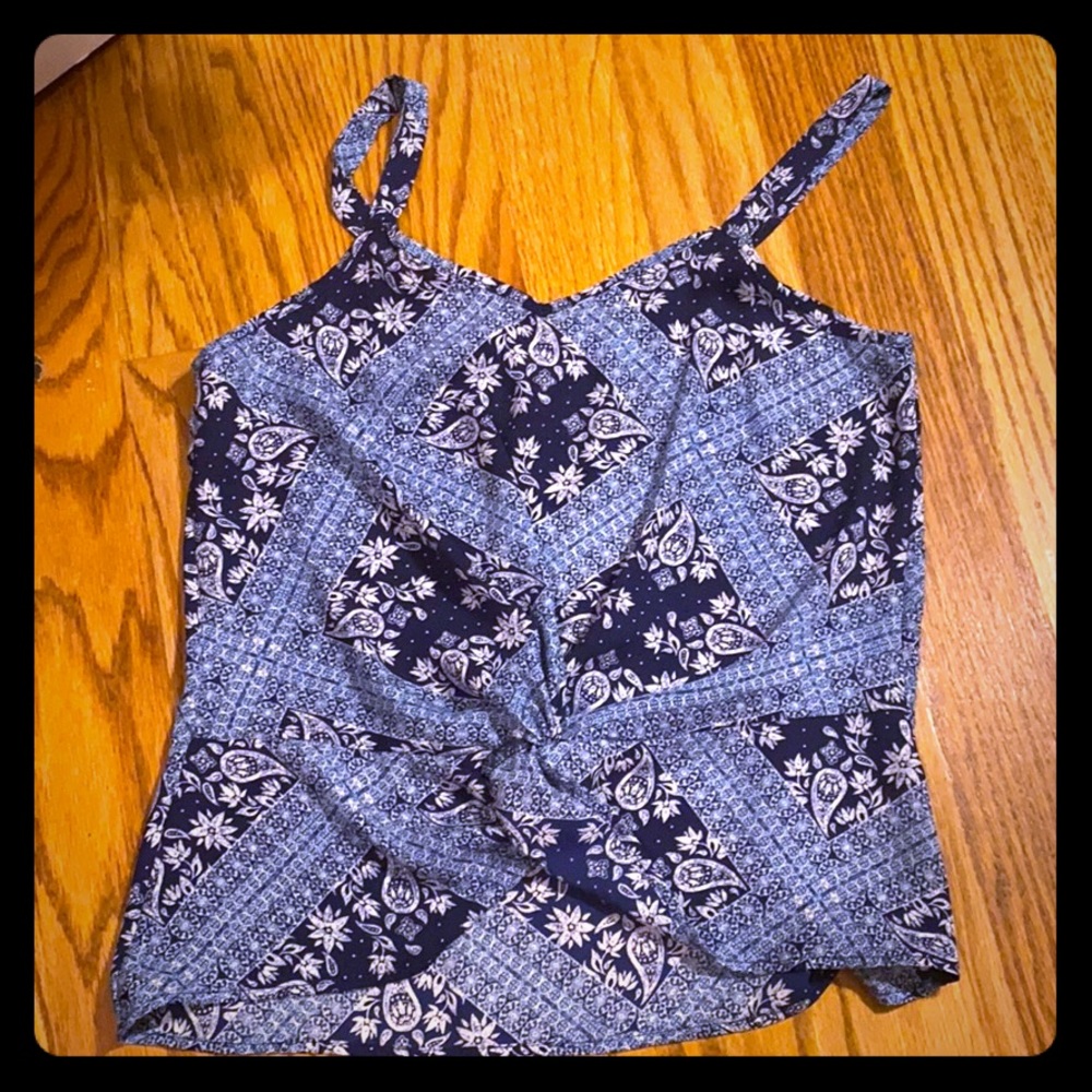 A blue tank top,worn once and in perfect condition